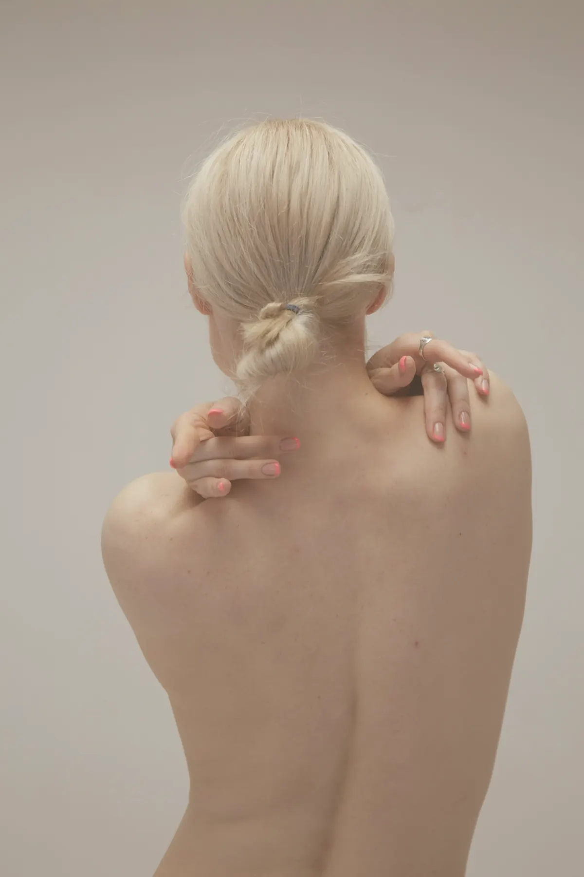 A bare back and shoulders in warm light